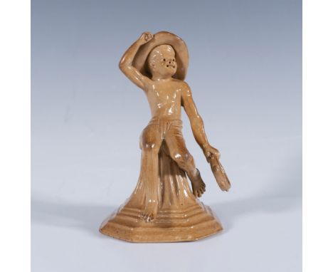 Stoneware salt glazed figure of Merry Musicians series. Features a boy seated on a tapering plinth playing the tambourine. Do