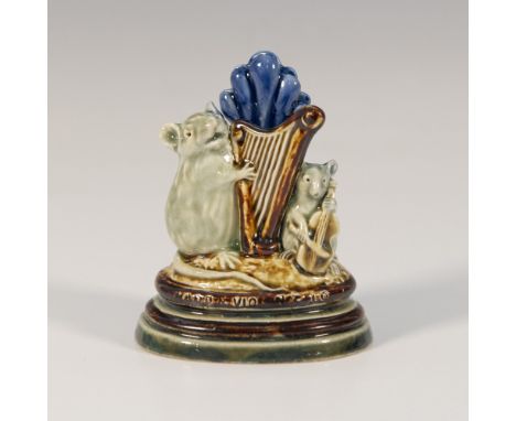 Harp and Violoncello. Blue and brown glaze; depicts two mice playing musical instruments. Doulton Lambeth impressed stamp. Ge