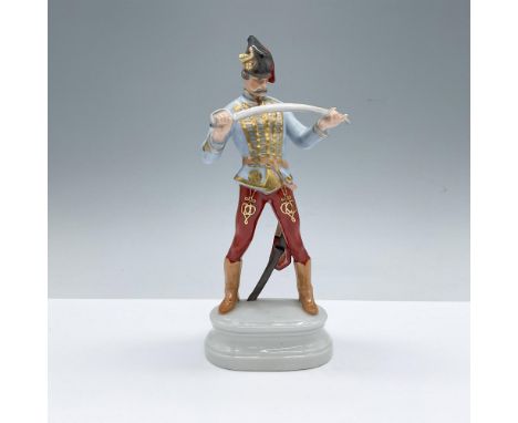 Part of the Traditional Hungarian People collection. Hand decorated figure of a Hungarian soldier in dress uniform holding a 