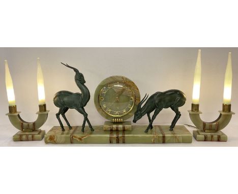 A large Art Deco French marble and onyx mantle clock garniture. Wind up clock, in working order with gilt numeral markers, ha