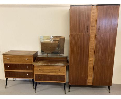 A 3 piece vintage 1960's bedroom suite, comprising wardrobe, Chest of drawers and dressing chest. Veneered multi coloured woo