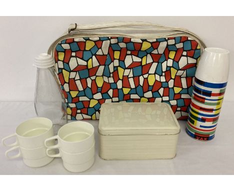 A vintage 1960's multicoloured vinyl lunch/picnic bag complete with original unused contents. Contents comprise: tin sandwich