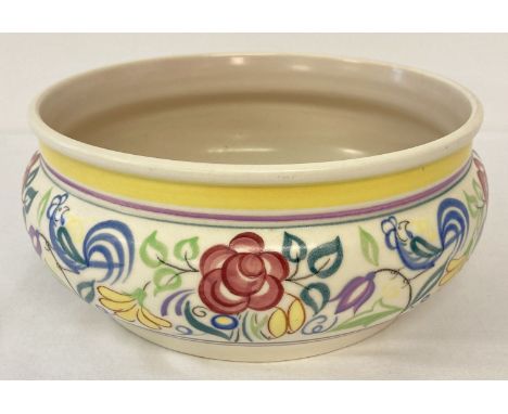 A Poole Pottery bowl decorated with floral and bluebird design Le Pattern. Poole stamp and artists mark to base. Approx. 23cm