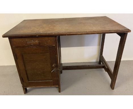 A vintage 1940's dark oak framed Utility desk with single drawer and cupboard.  Approx. 70cm tall x 106cm long.
