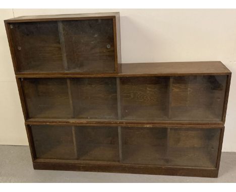 A vintage 1940's solid dark oak 3 sectional 'Unix' stacking system. Complete with wooden base plate and glass sliding doors. 