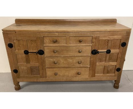 Robert Thompson - Classic Mouseman, 5'0" sideboard with wrought iron door furniture, circa 1951. A central bank of 2 over 3 g