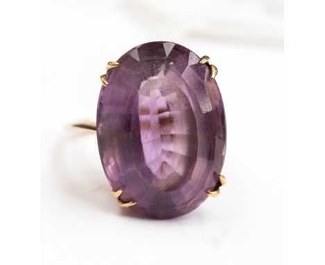 A large oval amethyst ring claw set in 9ct gold, stone size  20mm x 15mm, size K, with a total gross weight approx 7.5gms