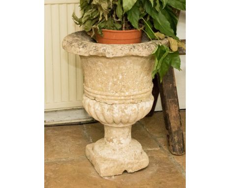 A limestone campana urn planter 