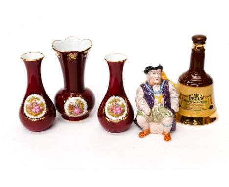Three Limoges vases, dark red ground, a Melba character jug Henry VIII and a Wade Bells whiskey decanter (5)