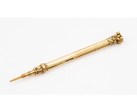 A Samson Mordan gilt metal propelling pencil with fluted shaft, stamped 'S Mordan & Co', with amethyst seal to the end termin