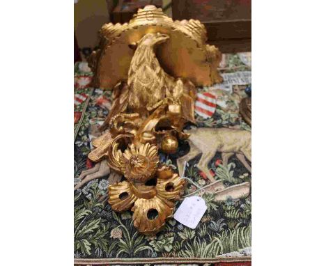 A pair of gilt griffin wall brackets, a grape decorated wall bracket, a modern armorial tapestry (4)