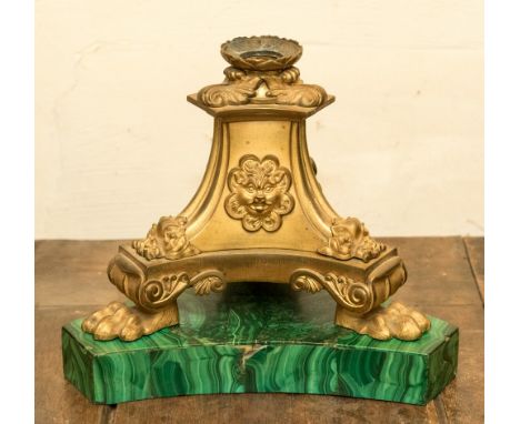 An ormolu and malachite candlestick base, tapered tripod form with grotesque snarling zoomorphic masks, on lions par feet, su