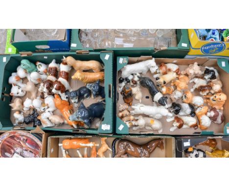 A large collection of Sylvac Dogs including Pug, Pekinese No. 3165, Dog with pipe in mouth, Dog playing with yellow ball, wal