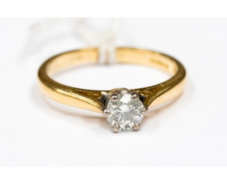  A diamond solitaire 18ct yellow gold ring, the round brilliant cut diamond approx 0.33ct, size K, with a total gross weight 