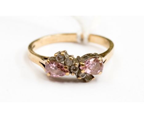 A 9ct gold ring set with two pear shape pink cz with a sweep of white cz running through the centre, size Q with a total gros