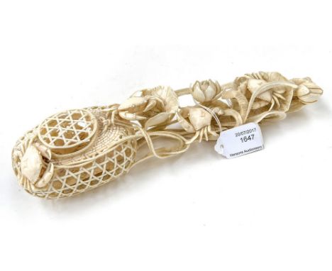 A Japanese ivory okimono of a crab basket, Meiji period (1868-1912), elaborately and fret carved with a crabs within the bask