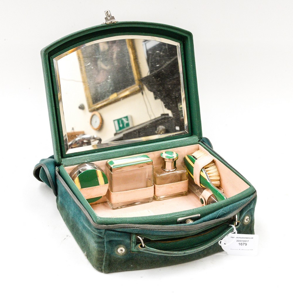 A 1920's Art Deco vanity case wih fitted interior, mirrored lid, four