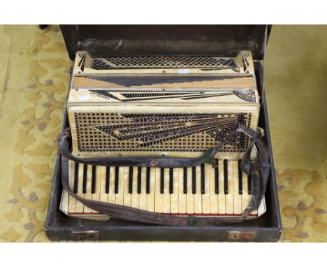 A cased vintage 20th Century Castello Soprani Settimio Accordion, having original case and leather straps 