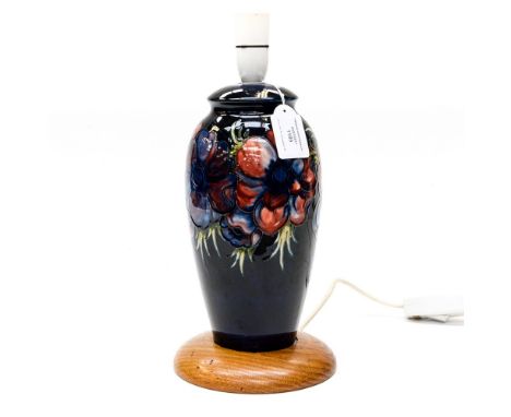 A Moorcroft baluster shape lamp base (with oak) support, blue ground, anemone patternPlease note: this item has failed its PA