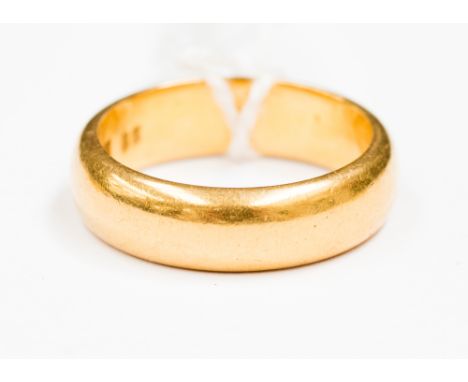 A 22ct gold wedding band, approx width 5mm, size K and with a weight approx 7.3gms