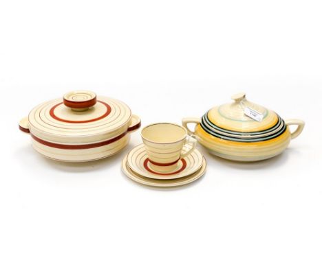Two Clarice Cliff casseroles and covers, with a teacup, saucer and tea plate (5) 