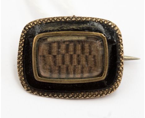 A Regency momento mori brooch with hair woven in a checkered design, the brooch measures approx 2cms across and 1 1/2 cms dow