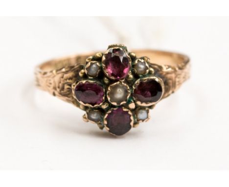 An amethyst and seed pearl set flower head cluster ring, set in 9ct rose gold, size O1/2 with a total gross weight of approx 