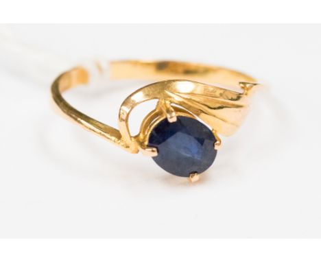 A sapphire and  18ct gold dress ring, claw set with an oval sapphire, size L1/2, with a total gross weight approx 1.4gms.