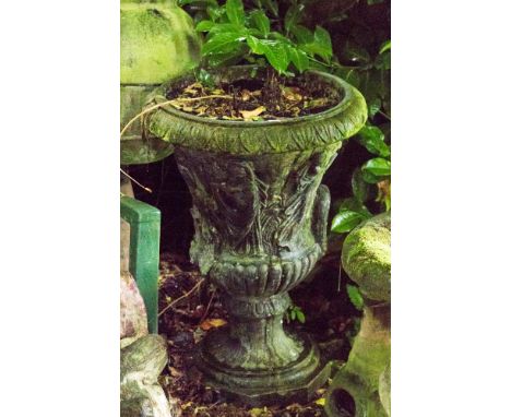 A cast iron campana urn planter, relief molded with figures, painted black