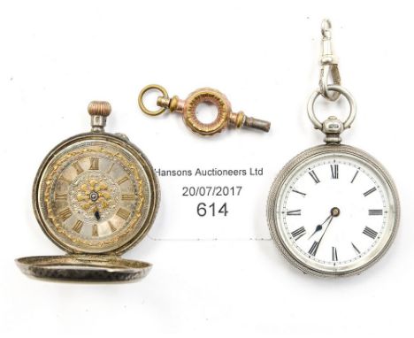 Two silver Victorian ladies pocket watches one with a white enamel dial the other with a silver and gold dial with a key. (2)