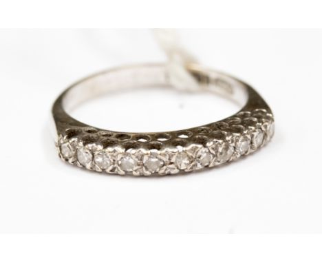 A diamond and 18ct white gold half eternity ring, set with eleven diamonds, total diamond weight approximately 0.33 carats, a