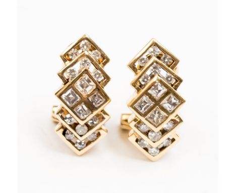 A pair of 14ct Italian diamond ear clips, geometric interlocking stepped square design each set with 16 square step cut and e