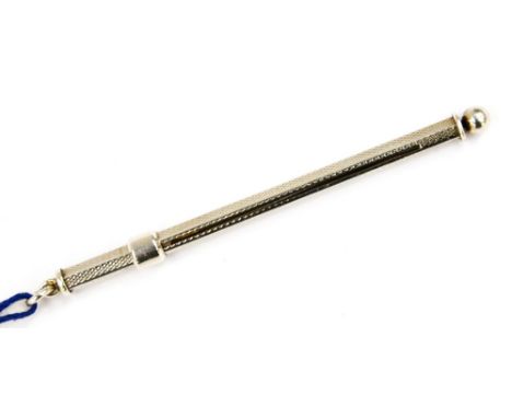 An Elizabeth II silver swizzle stick, Birmingham 1982, the case with engine turned decoration, makers mark for Ari D Norman, 