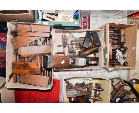 A large collection of wood working tools/planes, including various moulding plane irons  (three boxes) 