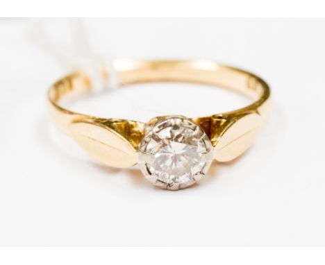  A diamond solitaire 18ct yellow gold ring. with claw set diamond, weighing approximately 0.40 carat, with leaf design should