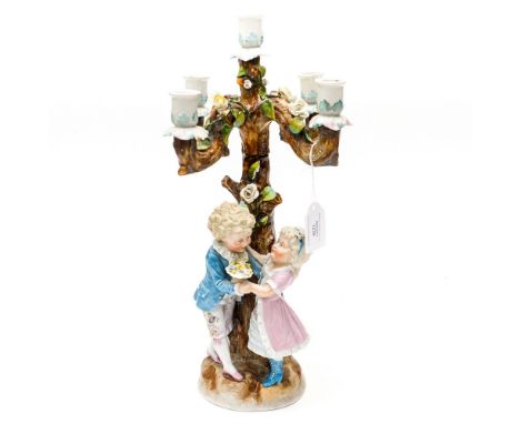  A late 19th Century Continental tinted bisque candelabra