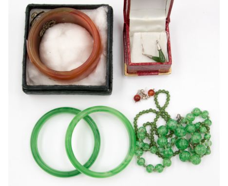 A collection of Chinese jewellery, including jade bangles, jade bead necklace and earring set, a Carnelian bangle etc, dyed j