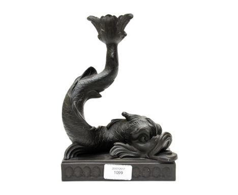 A Wedgwood black basalt dolphin candlestick, on shell bordered plinth approx 21cms high