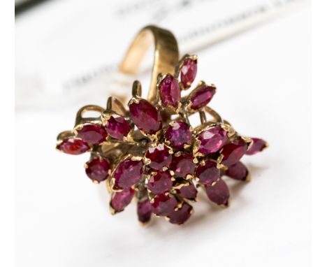 A 9ct gold multi tiered ruby ring claw set with marquise and round rubies, size O wth a total gross weight approx 5.1 grams 