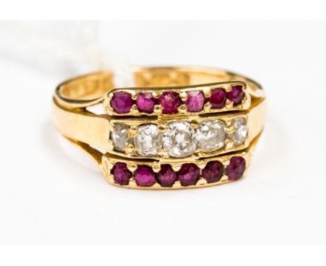 A Victorian diamond and ruby three row ring set in 18ct gold. The ring has a row of old cut diamonds to the centre with ruby 