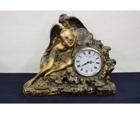A contemporary quartz bronzed mantle clock, William Widdop, dial having Roman numerals, surrounded by Angel in mound of rocks