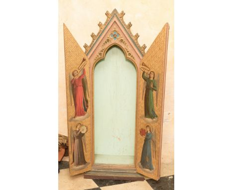 A Gothic Revival cupboard, the doors painted to the interior with angels playing musical instruments, within a relief fleur d