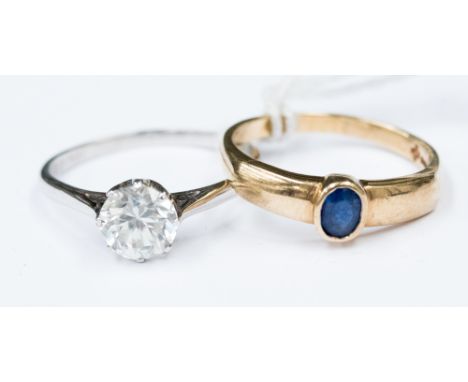 A sapphire and 9ct gold ring set with oval sapphire, size Q1/2, along with a white metal solitaire (partially stamped 18ct) s