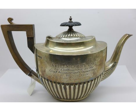 A silver teapot, with a L.M. &amp; S. Railway related inscription dated 1930, 677g, a/f, dented 