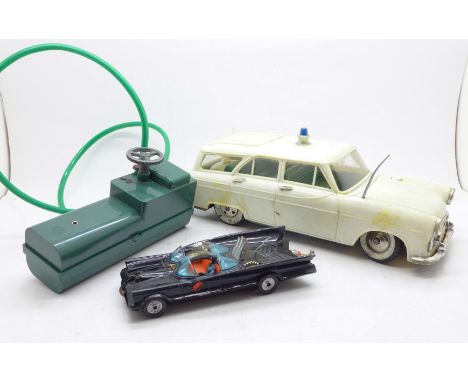 A battery operated remote control M1 Police Car, by Marx Toys, and a Corgi Toys Batmobile, a/f 