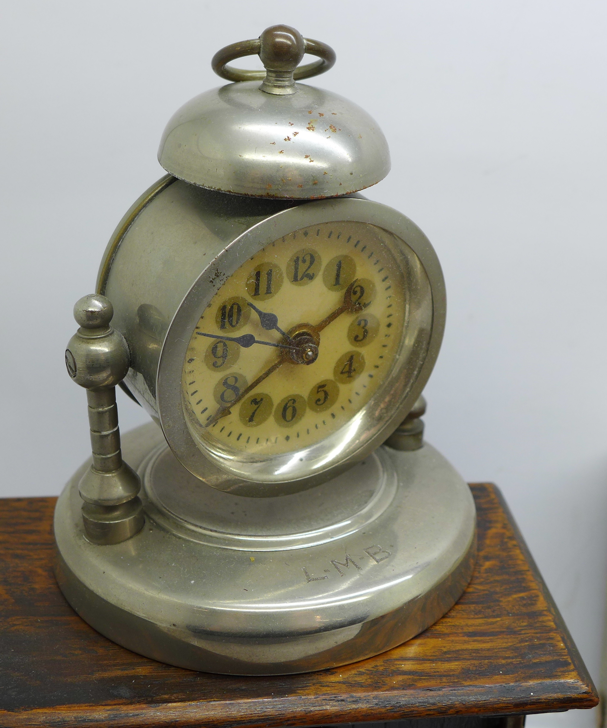 Two Smiths travel clocks, boxed, one other clock and an alarm clock