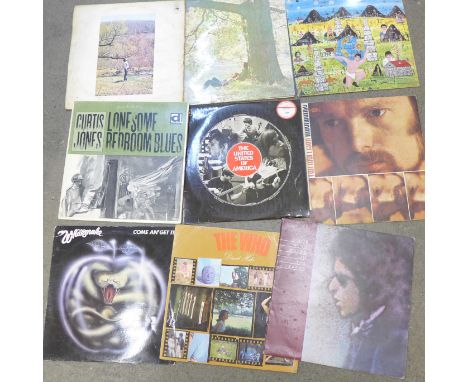 A collection of eleven LP records, including Bob Dylan and John Lennon 