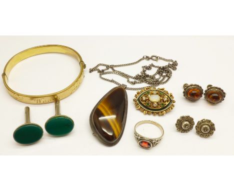A tigers eye set pendant/brooch on a silver chain, a silver ring, two pairs of earrings, a plated bangle, etc. 