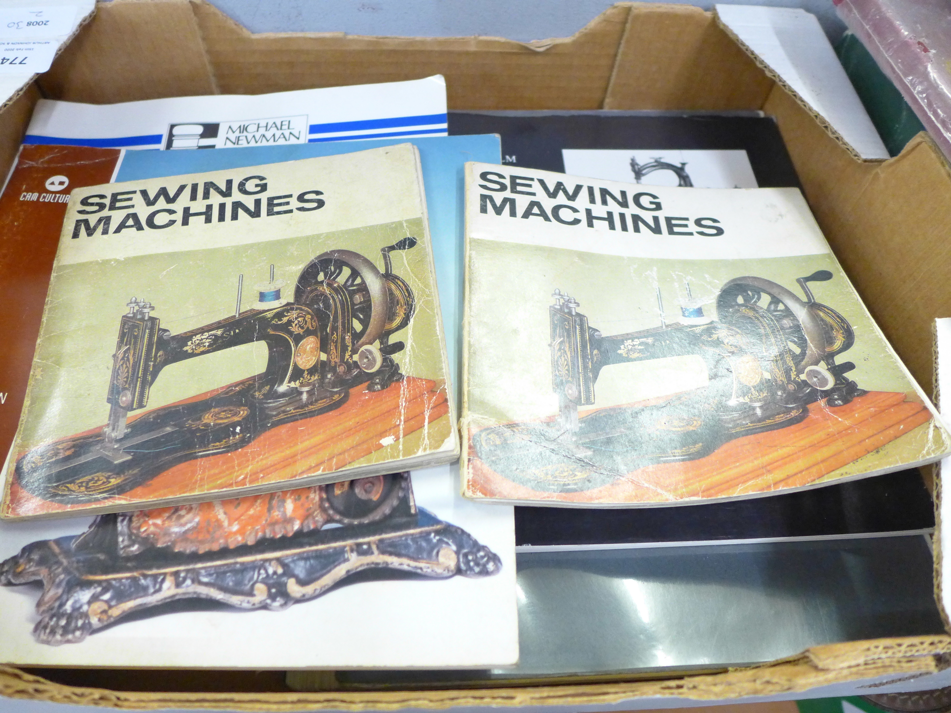 A collection of books on antique sewing machines and a Singer