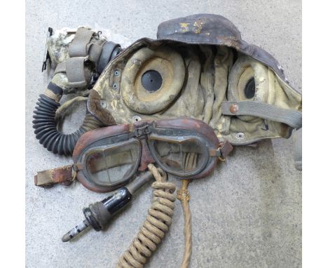 A WWII airman's leather flying helmet, goggles and mouthpiece, a/f 